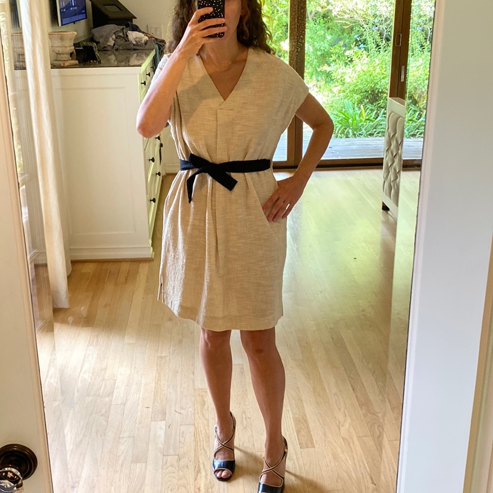 Pomandere tan dress with black ribbon belt